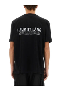 Back side of helmut lang men’s black limited edition t-shirt with white distressed text across the back