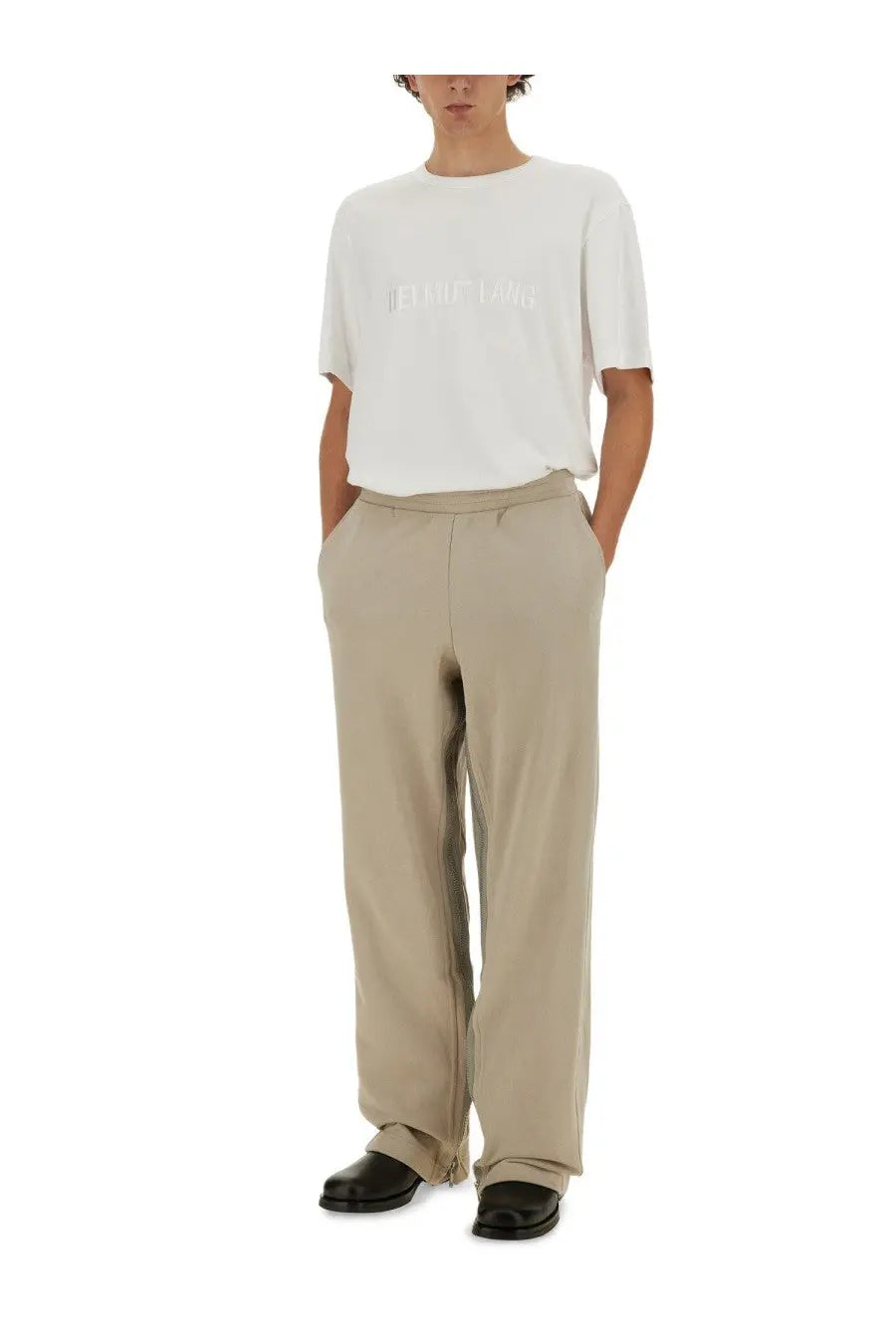 Beige wide-leg trousers with relaxed fit and subtle side seam detailing paired with helmut lang men’s white shirt