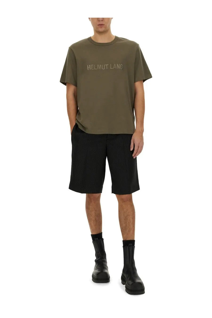 Olive green helmut lang t-shirt with subtle light logo across chest paired with tailored black shorts for men
