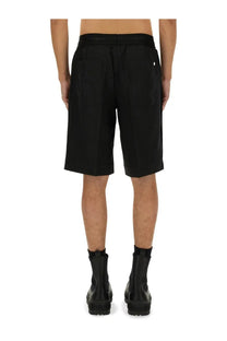 Black tailored shorts with drawstring waistband and two rear pockets shown from the back by helmut lang
