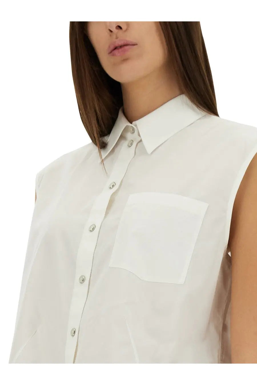White sleeveless button-up shirt with a crisp collar and matching pocket.