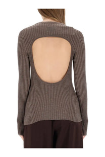 Back view of helmut lang women’s ribbed long-sleeved brown top with large open back cutout in muted taupe hue