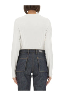 Dark blue denim trousers with high waist and prominent back pockets shown from the back for helmut lang women shirt white