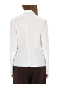 Helmut lang women’s off-white silk blouse with straight back seam and buttoned cuffs shown from the back side