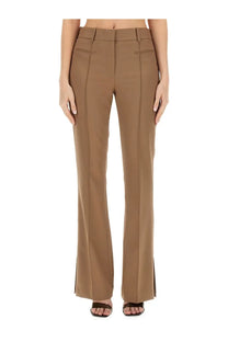 Helmut lang women’s slim fit beige pants in tan high-waisted flared style with tailored fit and subtle side slits