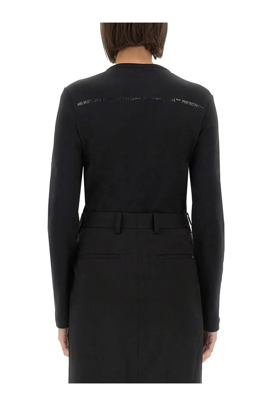 Back view of Helmut Lang women’s slim fit black long-sleeved top with subtle white text across the upper back