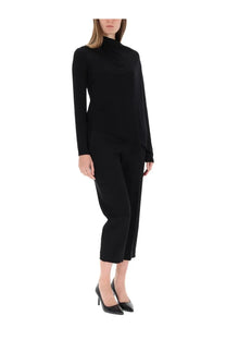 Helmut Lang women’s black knit top with high neck long sleeves and draped asymmetrical design
