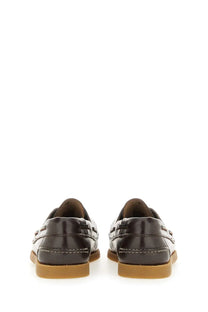 Black leather Hereu women’s boat moccasin with contrasting white stitching and tan rubber soles