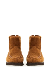 Hereu women’s tan faux fur ankle boots with suede-like texture and dark brown rubber soles