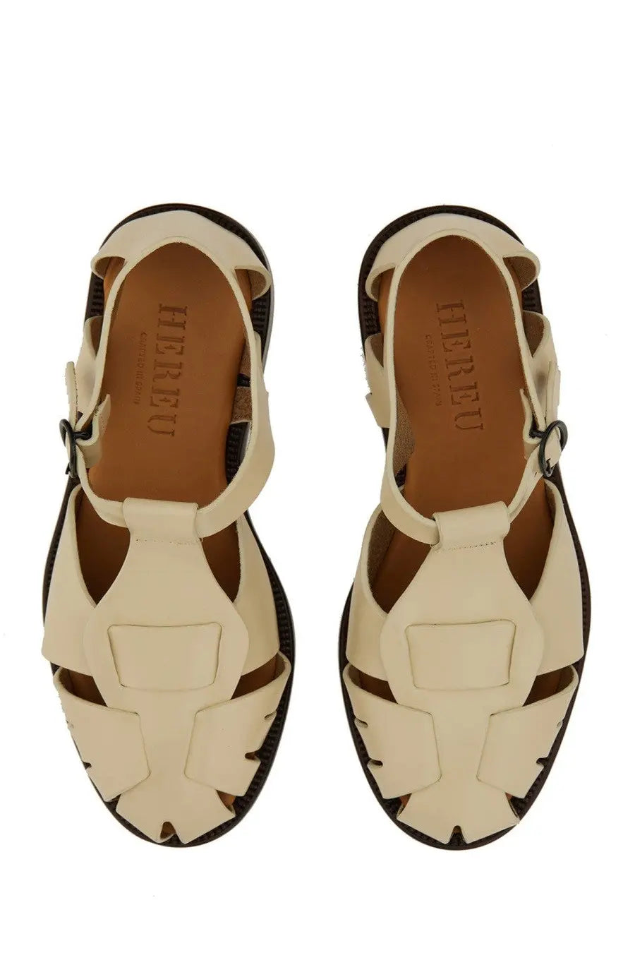 Hereu women’s cream-colored leather sandals with woven design and black rubber soles in peach beige color