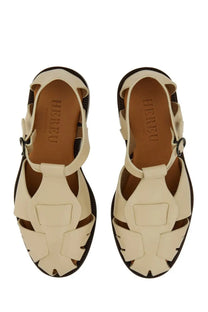 Hereu women’s cream-colored leather sandals with woven design and black rubber soles in peach beige color