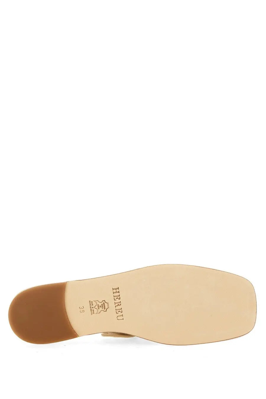 Beige leather sole with brown rubber heel and hearu branding on the back of hereu women’s shoe llasada white