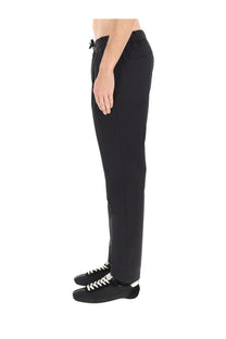 Herno men’s black tapered trousers with drawstring waistband and subtle side seam detailing for a sleek look