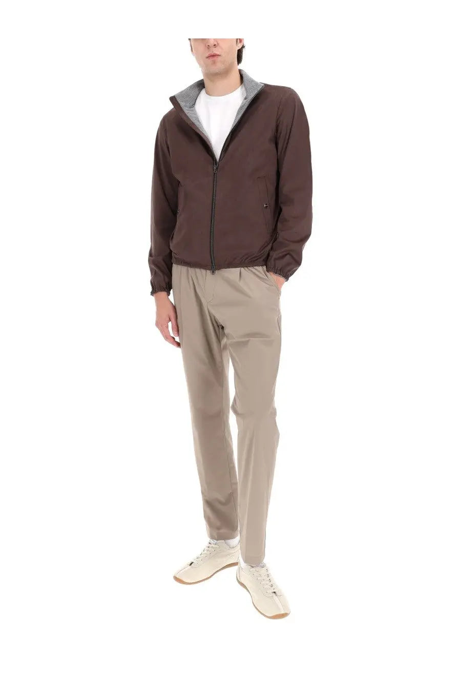 Brown zip-up jacket with gray inner lining and elastic cuffs shown with herno men’s grey pants