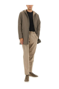 Herno men’s parka resort beige featuring a sleek olive-green hooded jacket with a subtle sheen and zippered pockets