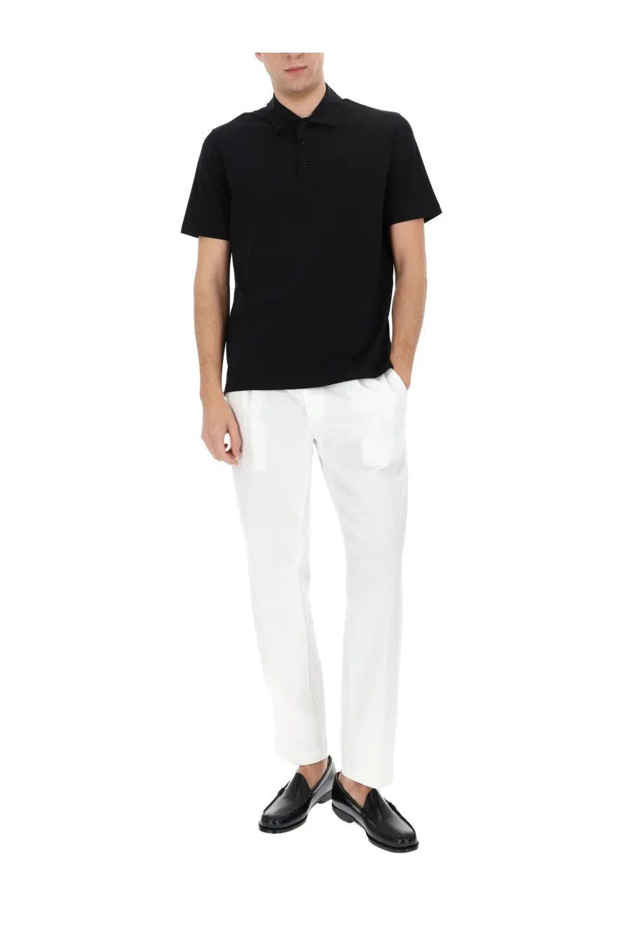Black short-sleeved polo shirt with classic collar and ribbed placket paired with herno men’s tailored white pants