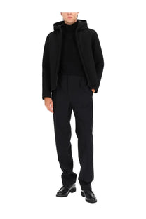Herno men’s black hooded three layer water repellent jacket with sleek modern design and subtle texture front view