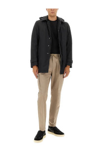 Herno men’s black two layer windstopper long parka with button closure and rolled up sleeves in a hooded jacket style