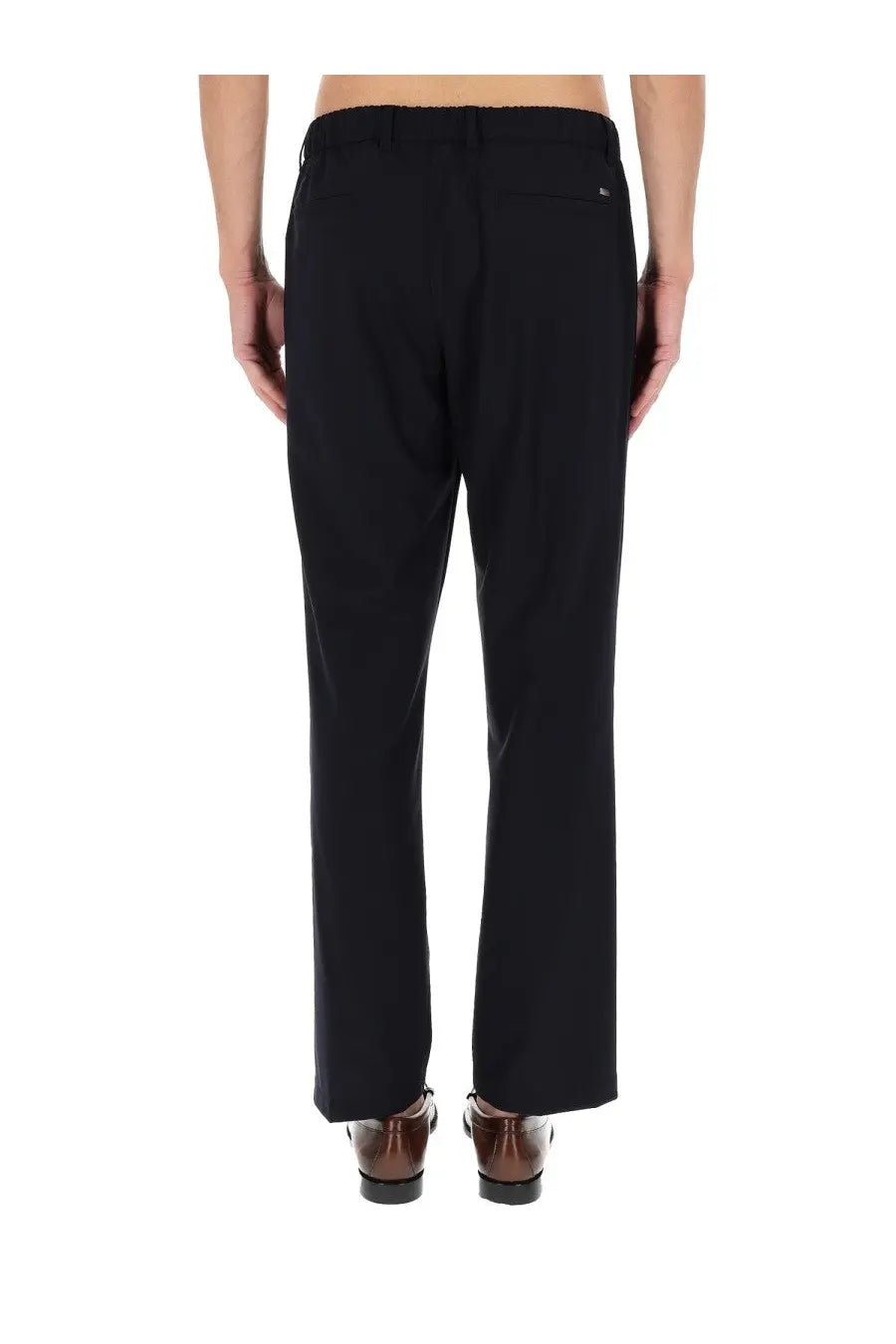 Black tailored wool blend trousers with a sleek straight-leg cut and subtle back pleats shown from the back side