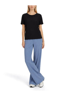 Black short-sleeved t-shirt with round neckline shown with herno women’s blue jogger pants front view