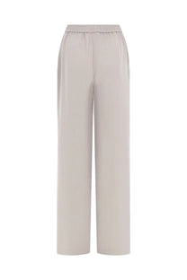 Beige herno women’s jogger pants with elastic waistband and smooth flowing fabric in wide-leg design