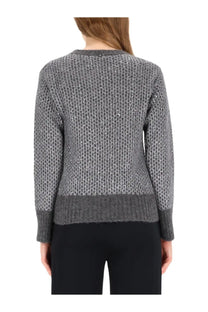 A textured gray knit sweater with subtle shimmering pattern and ribbed cuffs from herno women’s metallic effect jersey