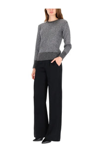 Herno women’s metallic effect sequin grey knit sweater with ribbed hem and cuffs worn over black wide-leg trousers