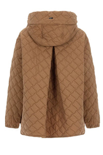 Herno women’s tan quilted jacket with diamond-stitched pattern and hood in lightweight insulated material