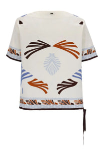 Herno women’s summer print cream blouse with short sleeves and bold brown orange blue leaf pattern on front