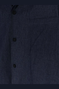 Hevò men’s blue denim shirt in dark blue with black buttons and a single chest pocket made of denim material