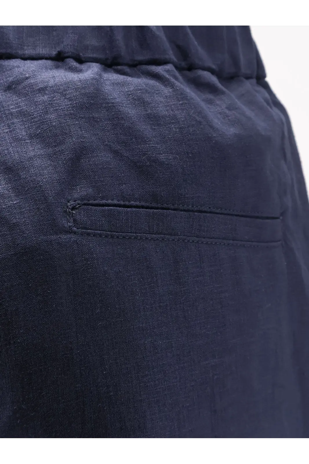 Hevò men’s linen and viscose trousers in dark blue with a subtle woven texture and simple stitched pocket visible