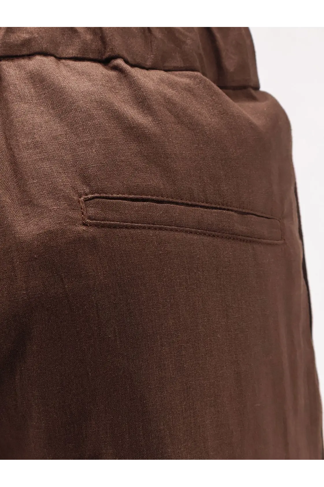 Brown hevò men’s torre chianca linen and viscose trousers with subtle texture and single welt pocket back view