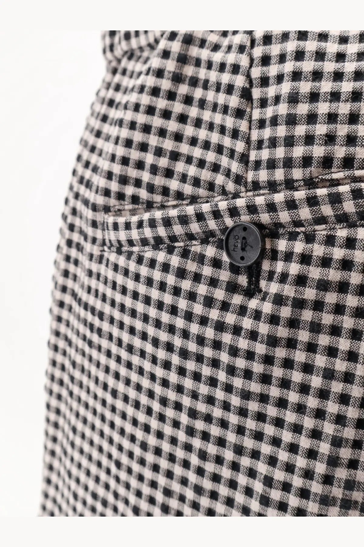 Hevò men’s torre lapillo checked shorts black featuring black and white checkered fabric and black button with brand logo