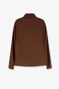 A sleek brown blouse with long sleeves soft smooth fabric and a classic collar complementing hevò men’s verdemare wool blend jacket