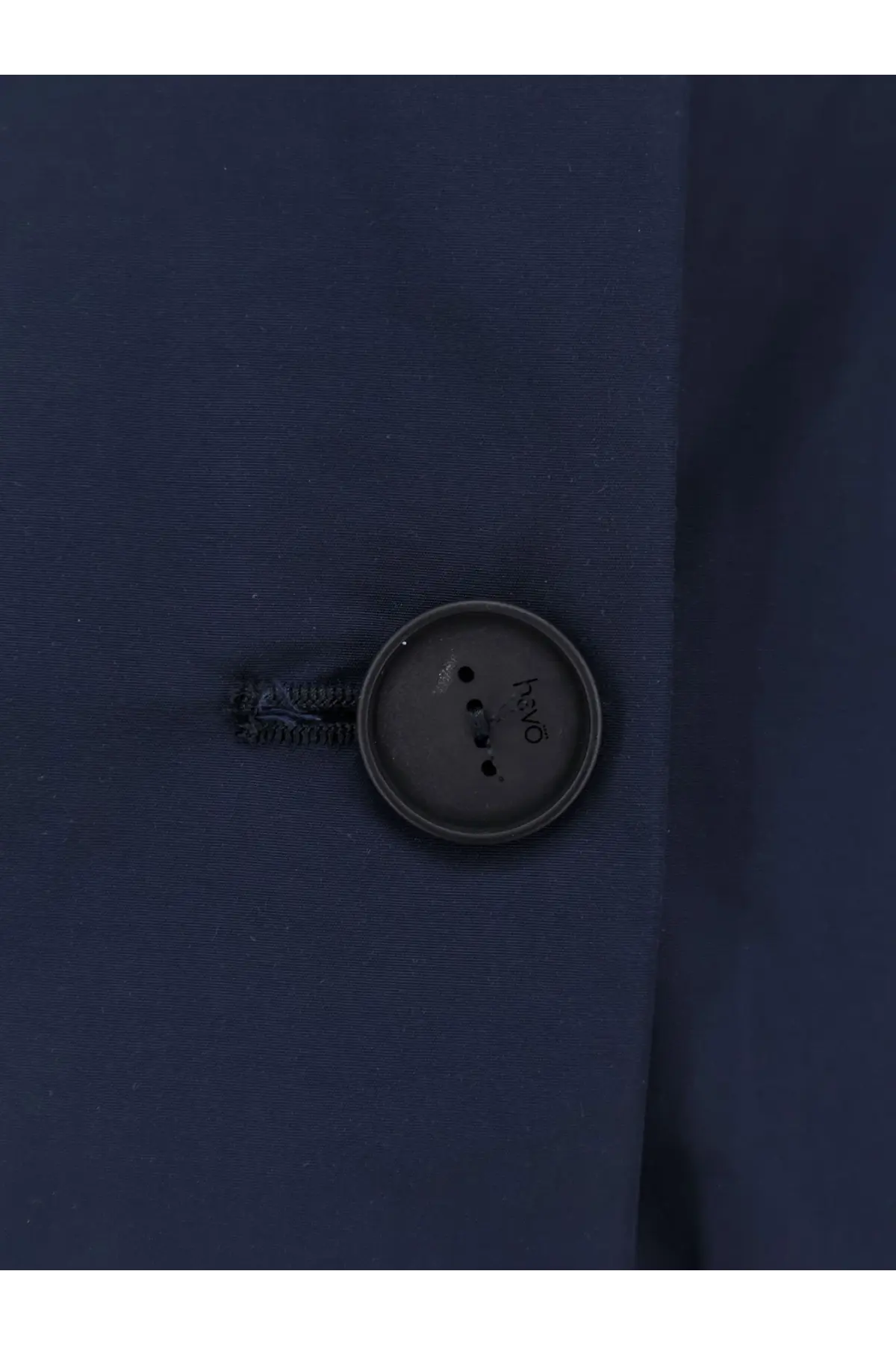 Dark gray hvo button on navy blue cotton blend fabric of hevò womens cala paradiso raincoat