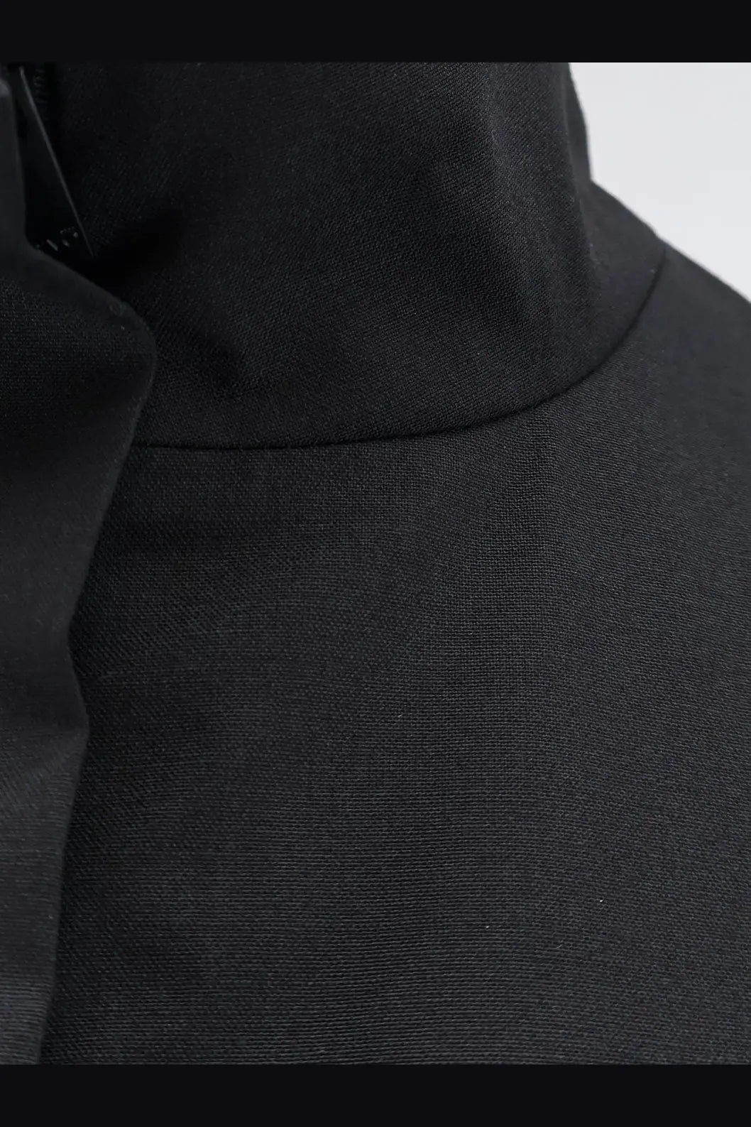 Black textured fabric collar of hevò womens porto selvaggio wool blend jacket showcasing premium material and design