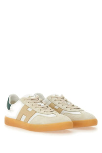 Beige and white suede hogan men’s sneaker cool white with green heel tab and orange rubber sole shown from the back