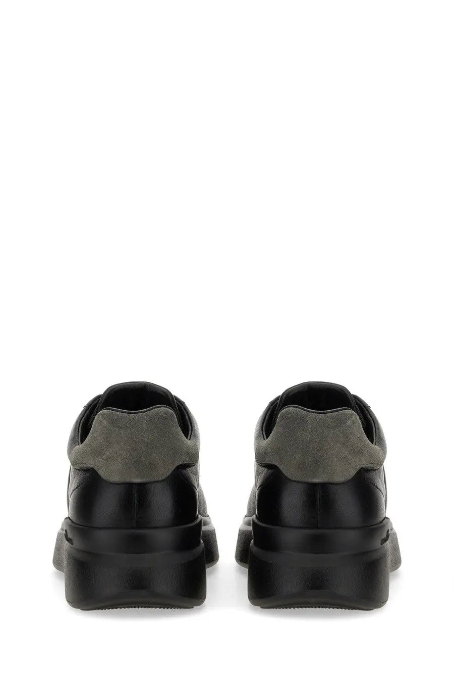 Hogan men’s sneaker h580 black in black and olive green suede and leather with a chunky rubber sole front view