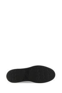 Black rubber sole with wavy tread pattern of hogan men’s sneaker h580 black for enhanced grip and durability