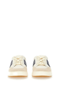 Cream-colored suede hogan men’s sneaker with dark gray side panels and white rubber sole for casual wear