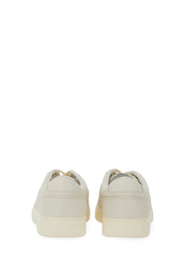 Cream-colored leather low-top Hogan men’s Hogan TV sneakers with minimalist design and matching rubber soles