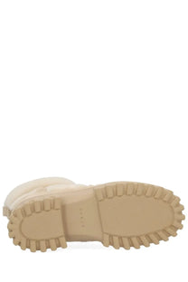 Cream-colored rubber sole with textured ridged tread on hogan women’s boot ankle h700 beige for traction and durability