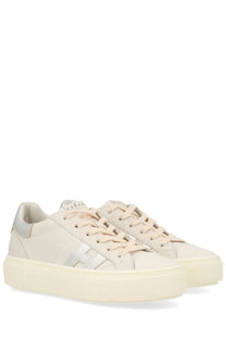 Cream-colored hogan women’s crosswind sneaker with silver logo and platform sole in white