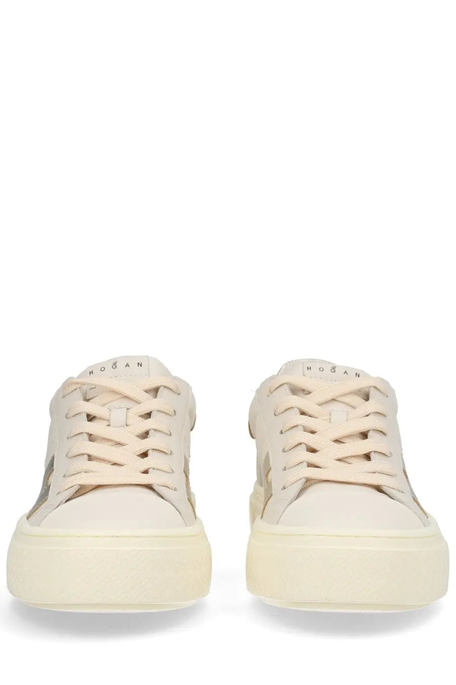 Cream-colored Hogan women’s Crosswind sneakers with sleek minimalist design and subtle metallic side accents