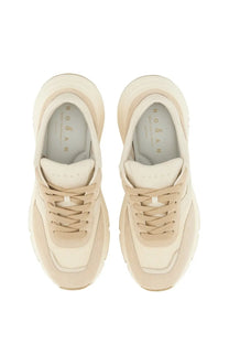 Cream-colored Hogan women’s leather sneaker with chunky sole and suede mesh upper in beige