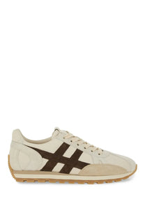 Hogan women’s sneaker beige cream-colored suede with bold brown stripe design and tan rubber sole front view