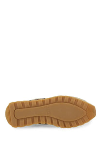 Tan rubber sole of hogan women’s sneaker 86er beige with textured ridged pattern and smooth central section
