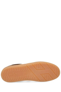 Tan rubber sole of hogan women’s sneaker cool brown with embossed hogan logo and geometric tread pattern