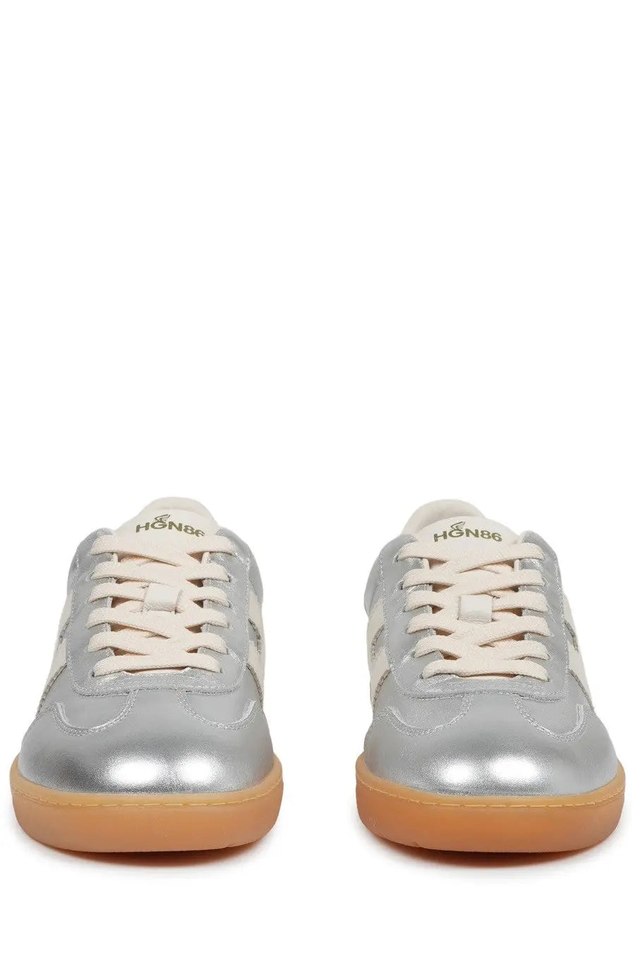 Hogan women’s sneaker cool silver featuring silver metallic material cream laces tan rubber sole and hon86 logo on tongue