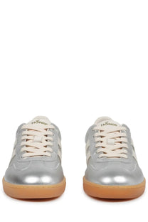 Hogan women’s sneaker cool silver featuring silver metallic material cream laces tan rubber sole and hon86 logo on tongue